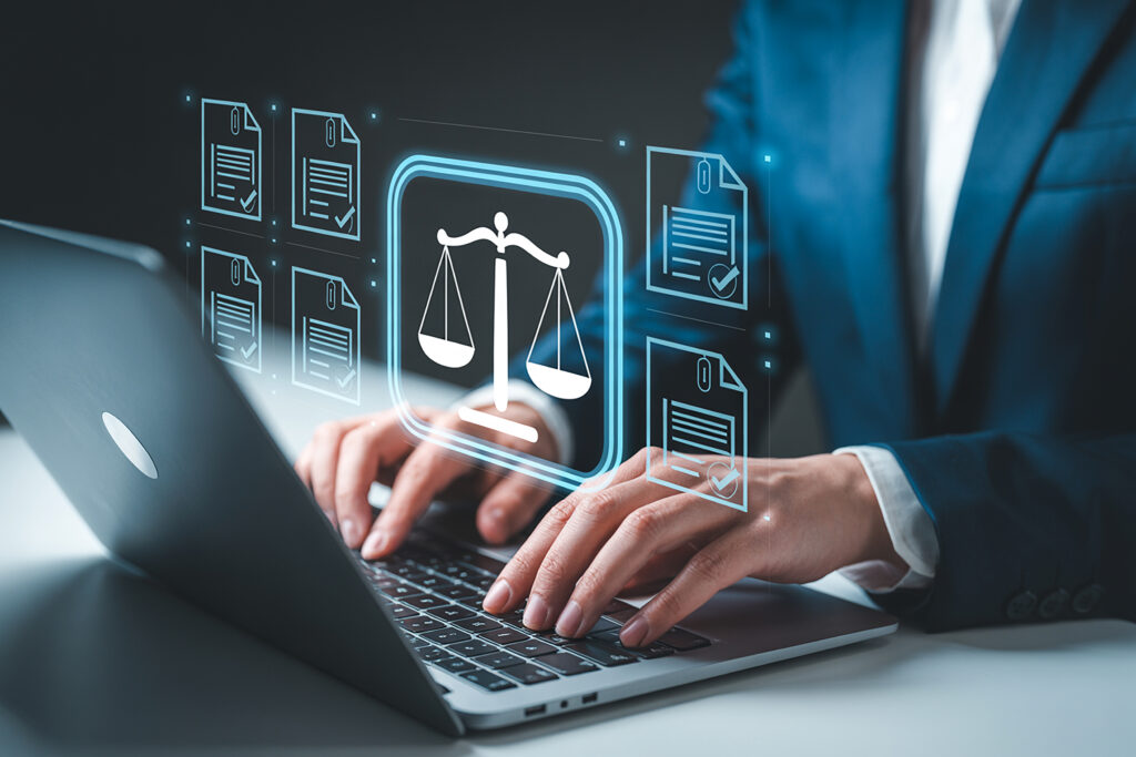 Businessperson using laptop with digital legal documents and scales of justice interface